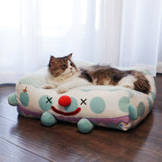 Clown Pet Sleeps In A Cozy Pet Bed